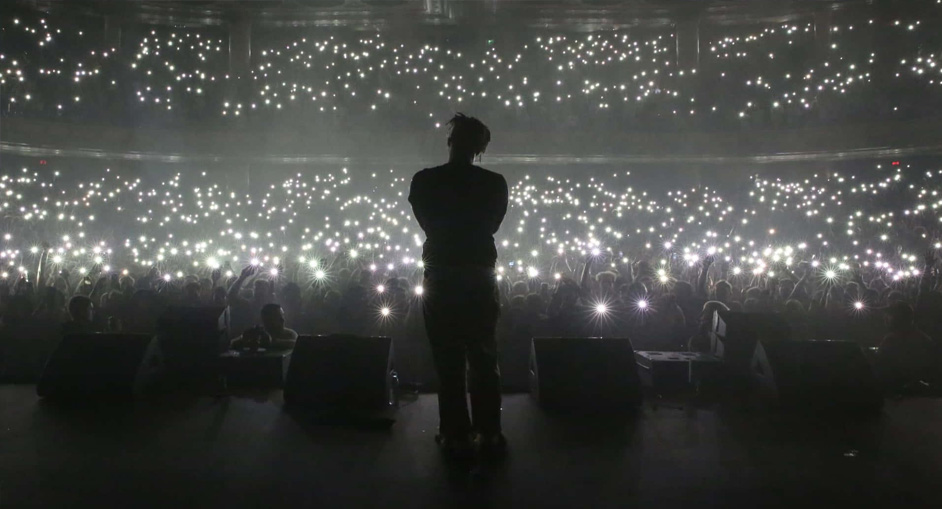Artist on stage in front of a crowd